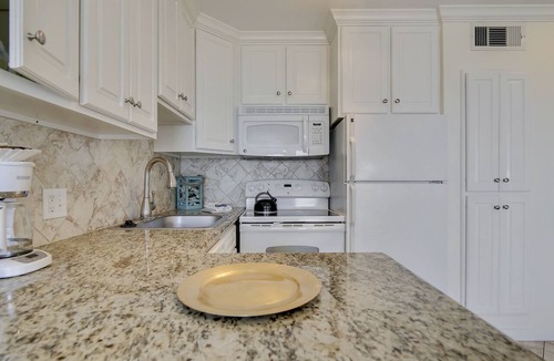 Galveston Condo | Beach Cottage steps from Surf. fishing. the Beach and Serene Sunsets (1303)