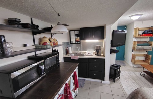 Northeast Kansas City Apartment | Cozy basement studio in Kansas City Missouri with private entrance and AC.