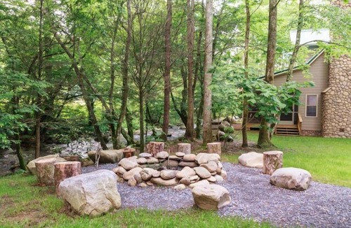 Cosby Cabin | Creekfront cabin with cozy interiors, hot tub & game room.