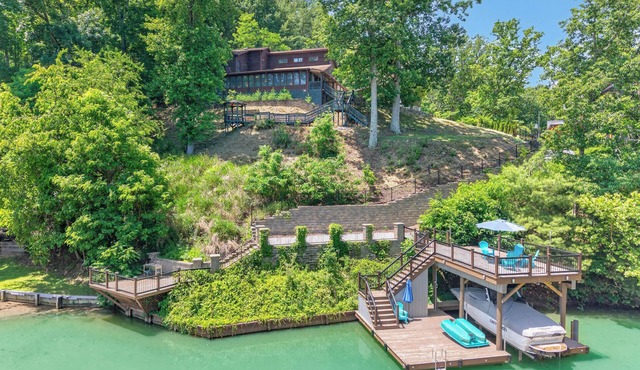 Lakefront retreat with private dock, lake views, spacious decks, pool table, and sun room!